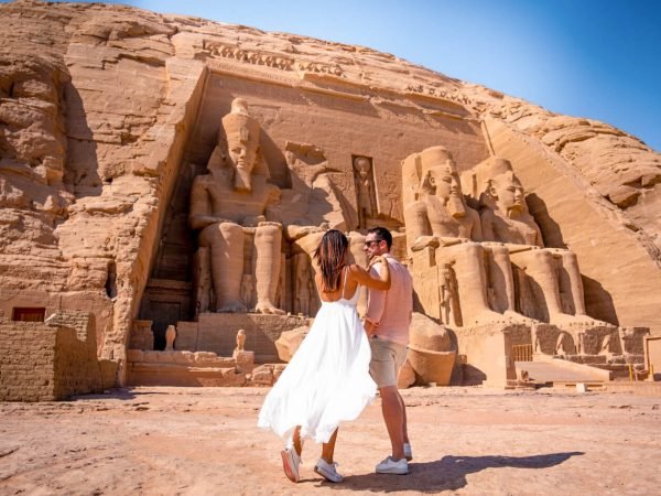 a-photo-of-a-couple-in-front-of-abu-simbel-temple-in-aswan