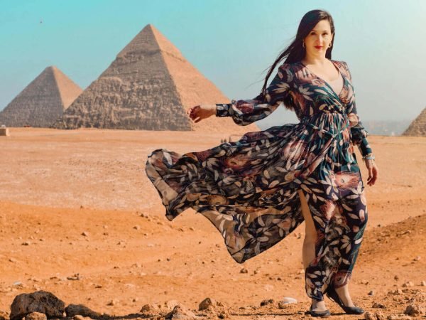 a-wonderful-shot-of-a-tourist-in-front-of-the-pyramids