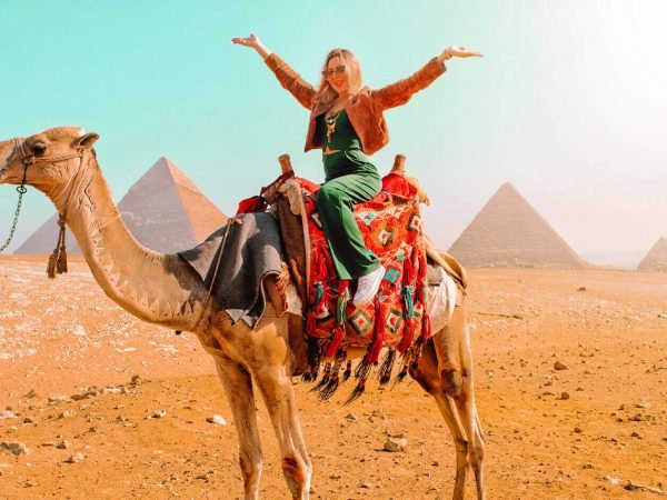 a-wonderful-shot-of-a-girl-on-the-camel-in-front-of-the-pyramids